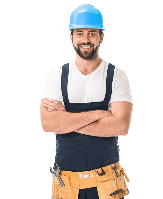 Man wearing a blue hard hat, white t-shirt, dark overalls, and a tool belt stands with arms crossed and smiling—ready to tackle any AC Installation or AC Repair needs with confidence.